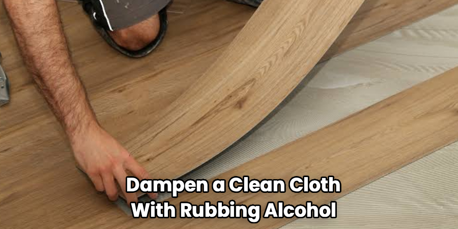 Dampen a Clean Cloth
With Rubbing Alcohol