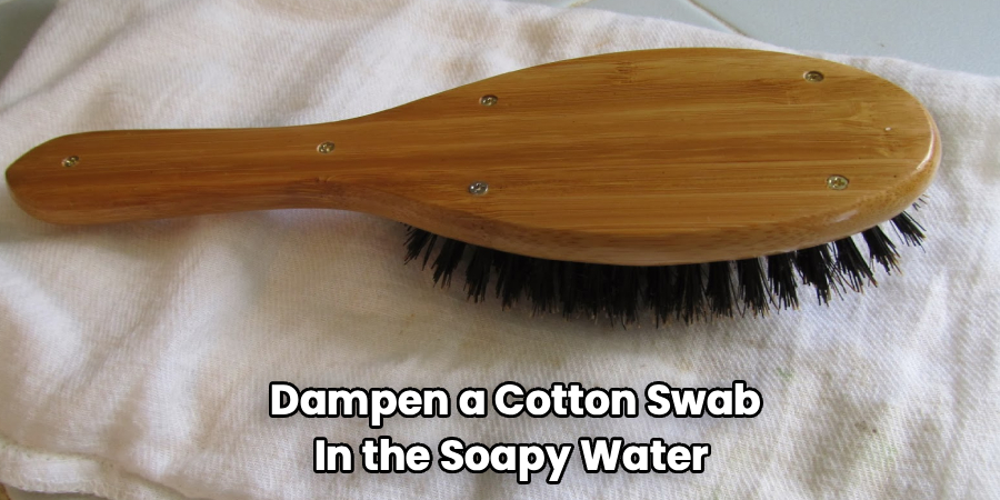 Dampen a Cotton Swab
In the Soapy Water 
